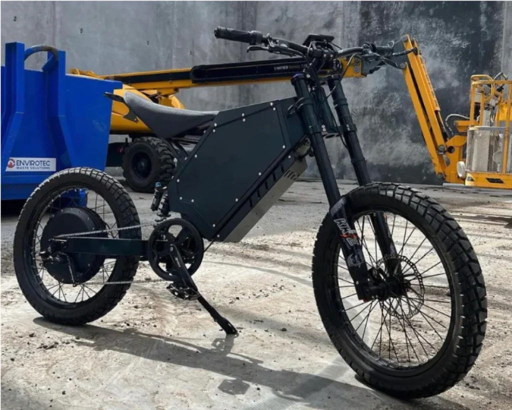 Black Stealth Bomber electric bike with turtle tires and motorcycle seat
